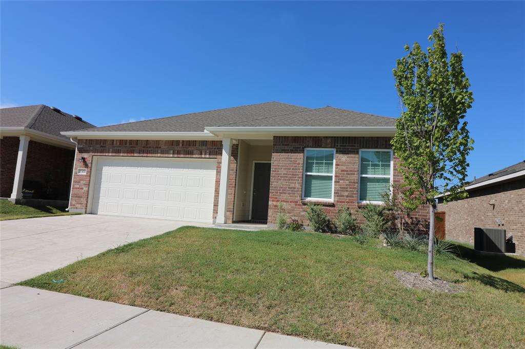 1301 Elliott Road Howe, TX 75459 - Photo 2 of 27 Brick exterior with white window frames and a single car garage