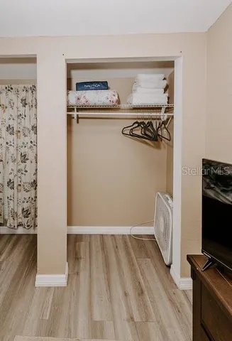 a view of a livingroom with wooden floor