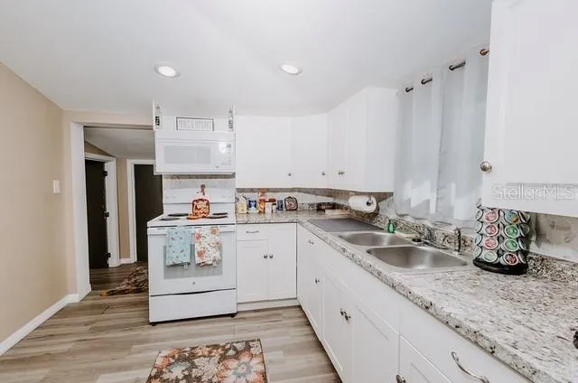 a kitchen with a sink and cabinets