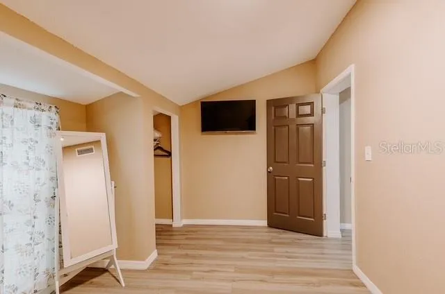 a view of a livingroom with wooden floor
