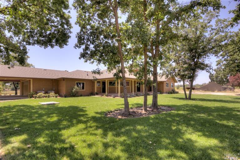 3679 Piner Road Santa Rosa, CA 95401 - Photo 1 of 1 a view of a house with a big yard and large trees