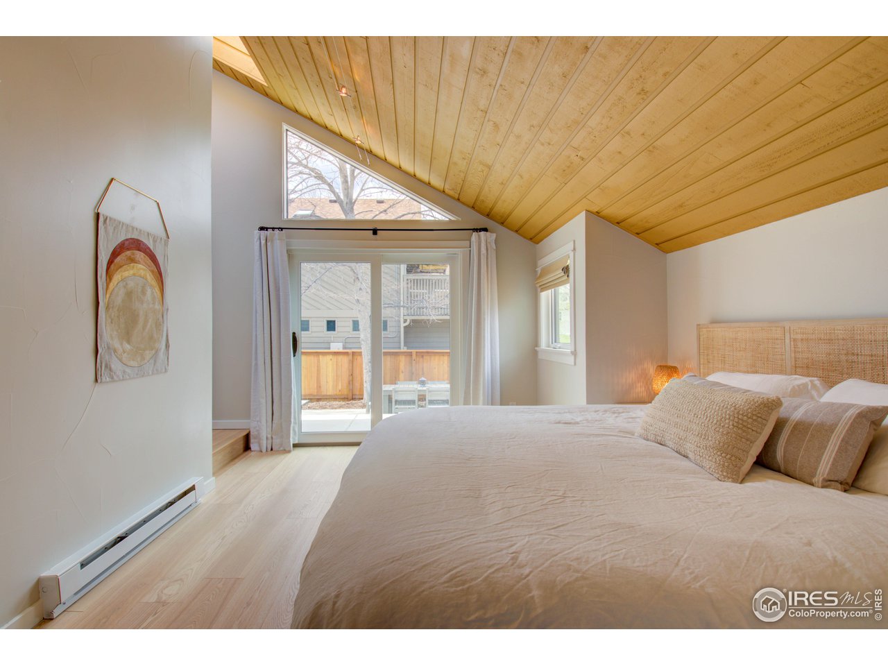 3035 Galena Way Boulder, CO 80305 - Photo 19 of 40 a bedroom with a large bed and a large window