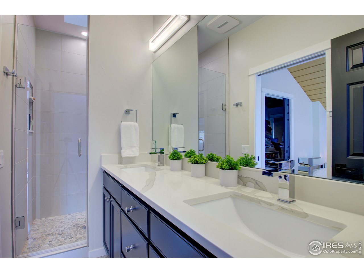 3035 Galena Way Boulder, CO 80305 - Photo 21 of 40 a bathroom with a sink and a mirror