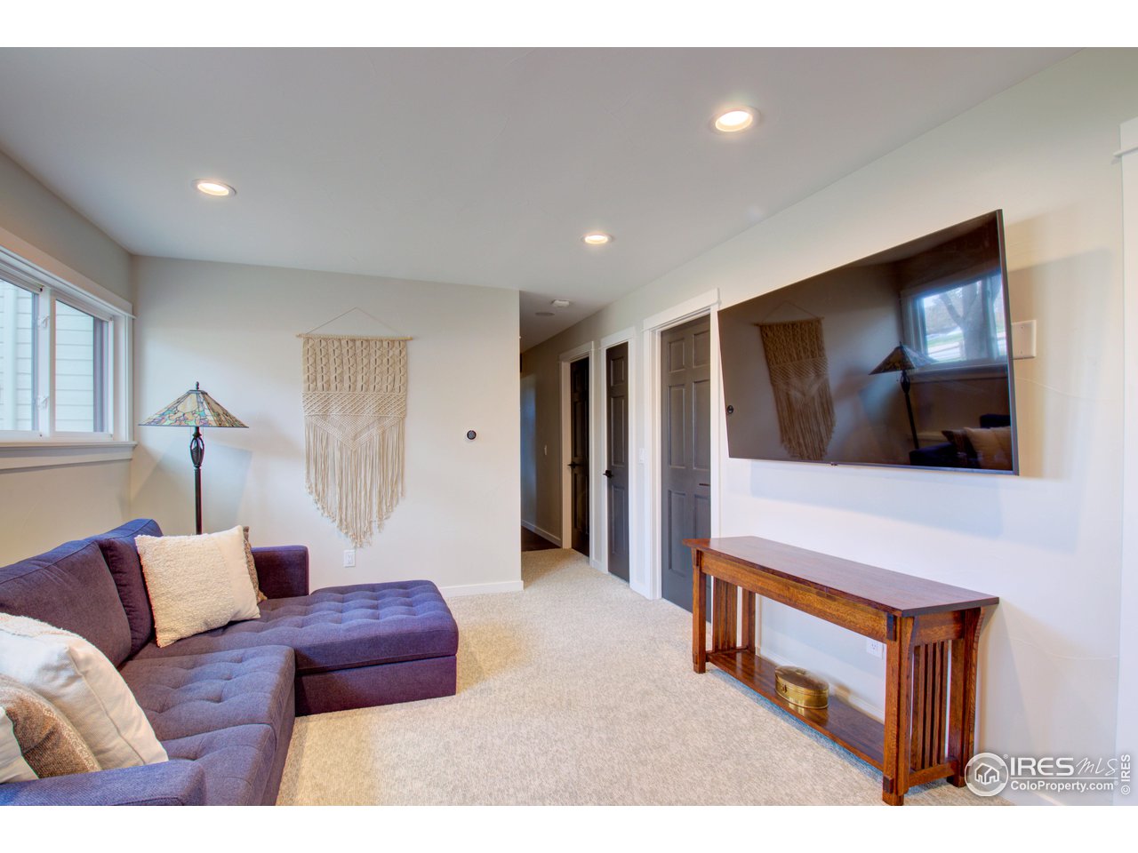 3035 Galena Way Boulder, CO 80305 - Photo 24 of 40 a living room with furniture and a flat screen tv