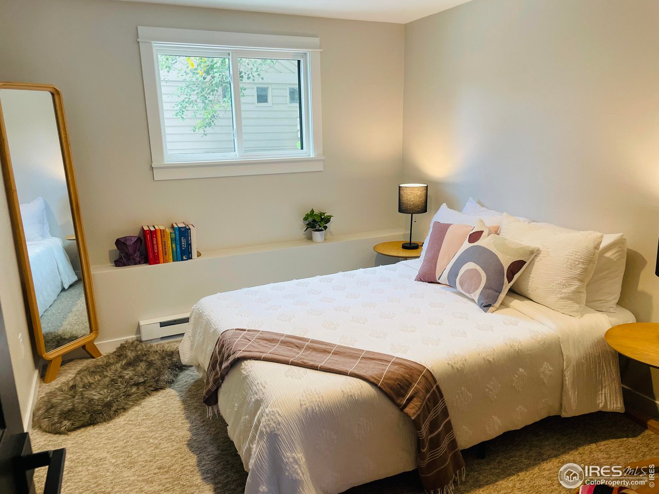 3035 Galena Way Boulder, CO 80305 - Photo 27 of 40 a bedroom with a bed and a window