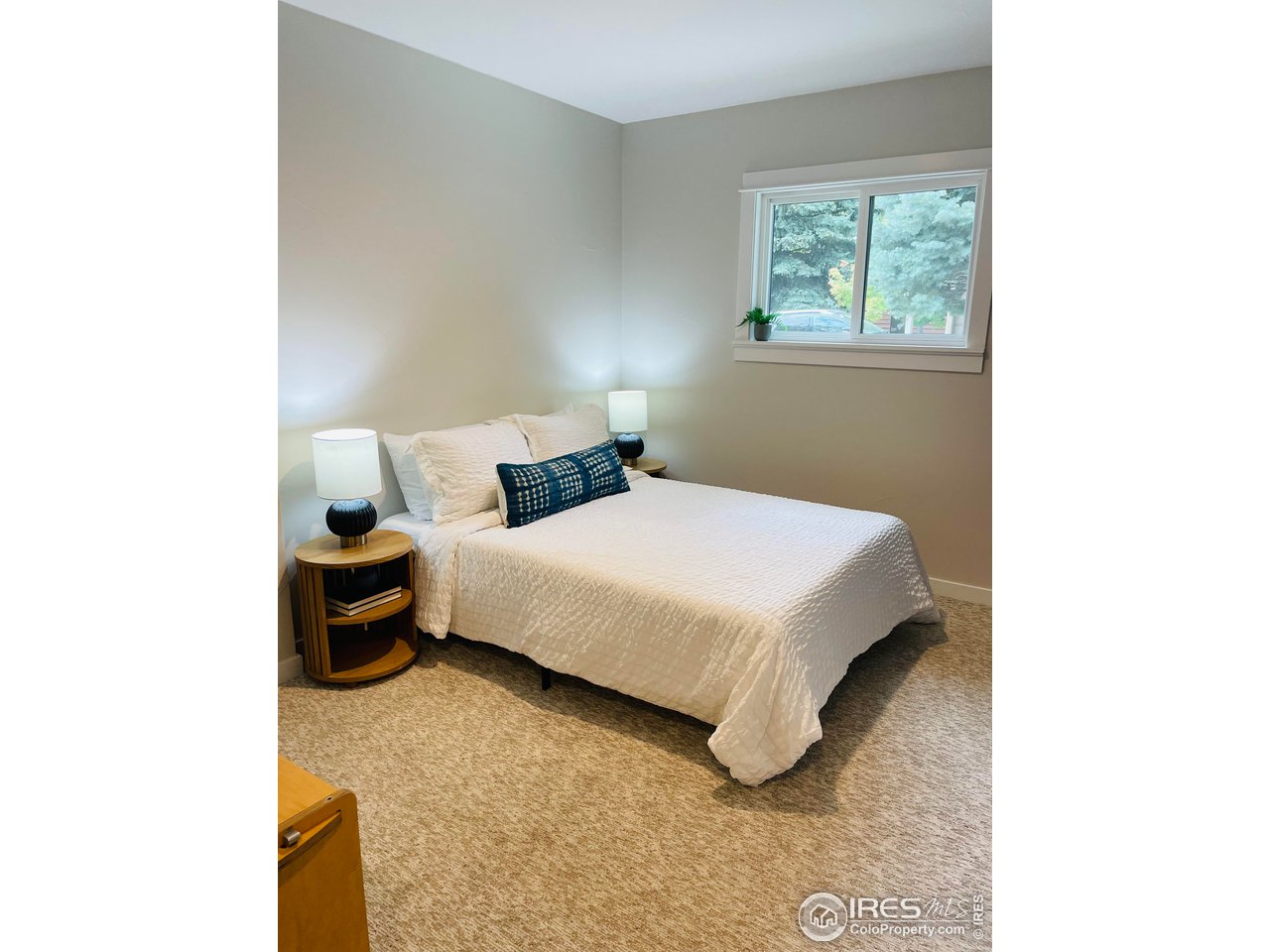 3035 Galena Way Boulder, CO 80305 - Photo 28 of 40 a bedroom with a bed and a window