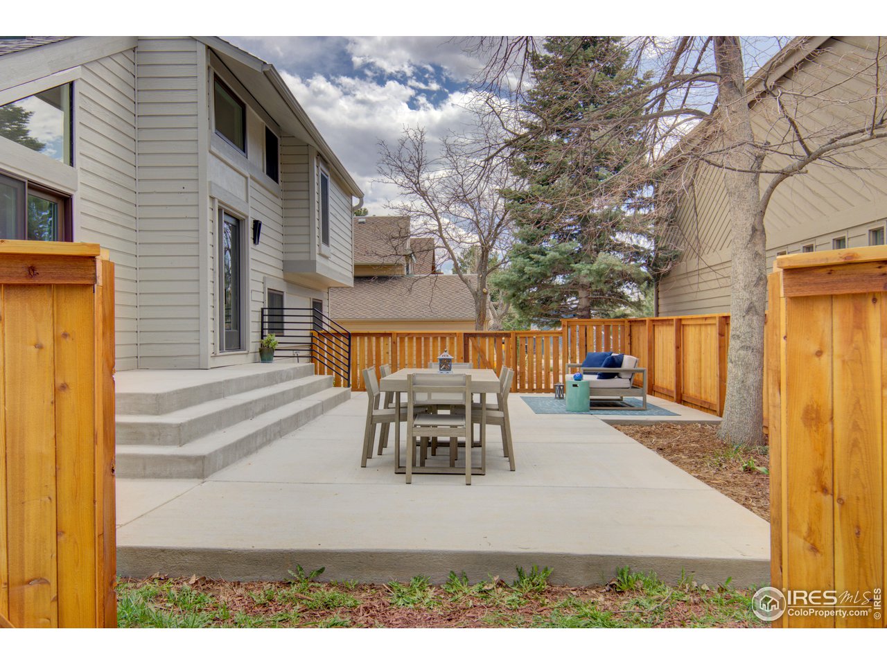 3035 Galena Way Boulder, CO 80305 - Photo 32 of 40 a view of a patio with table and chairs with wooden floor