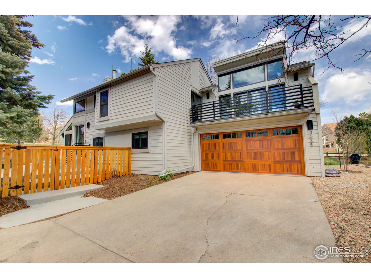 3035 Galena Way Boulder, CO 80305 - Photo 36 of 40 a front view of a house with a yard with garage
