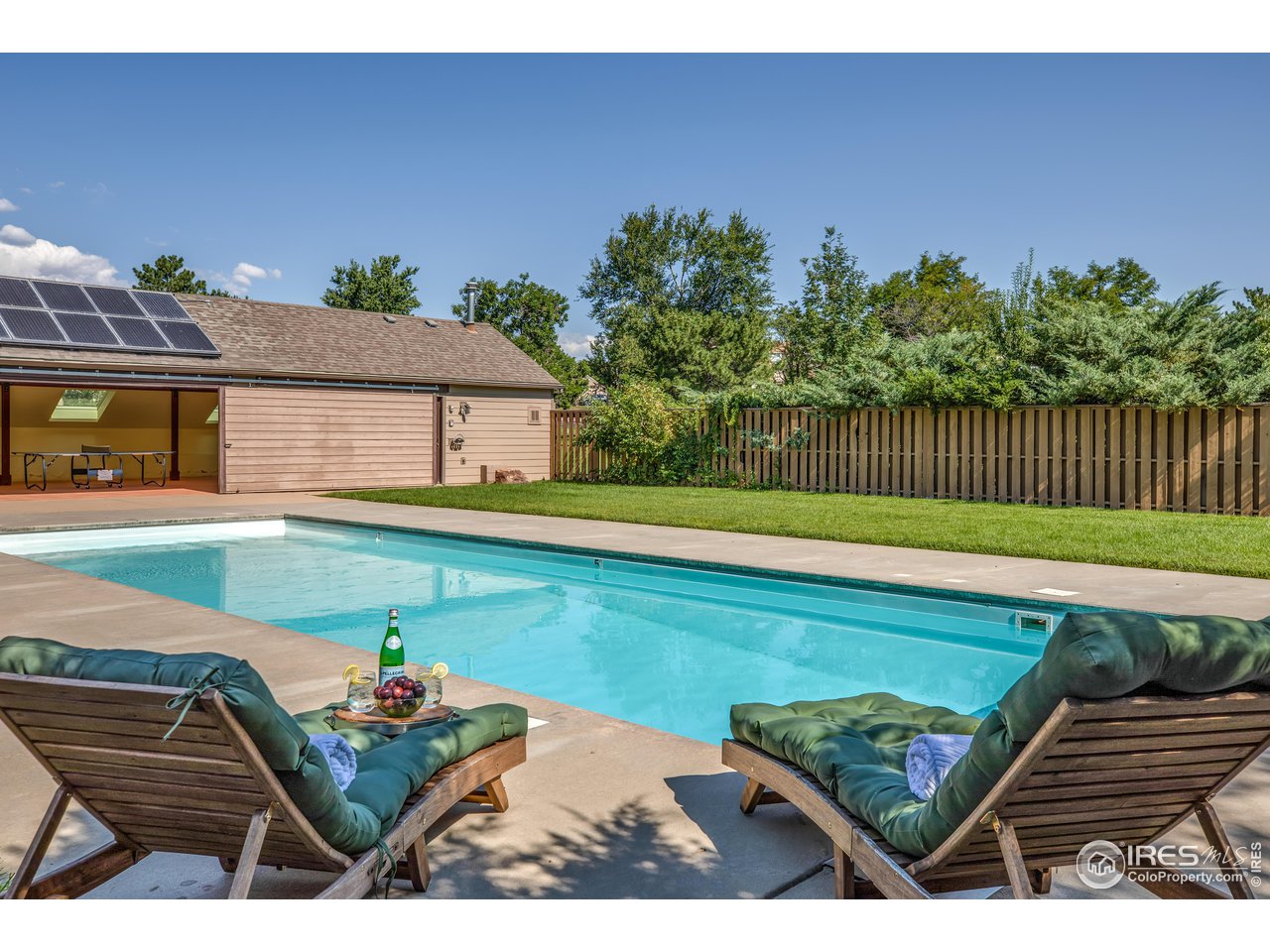3035 Galena Way Boulder, CO 80305 - Photo 37 of 40 a view of a backyard with a garden and outdoor seating