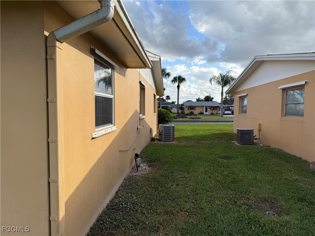 2211 Orchid Road Lehigh Acres, FL 33936 - Photo 4 of 11 a view of a porch in front of house