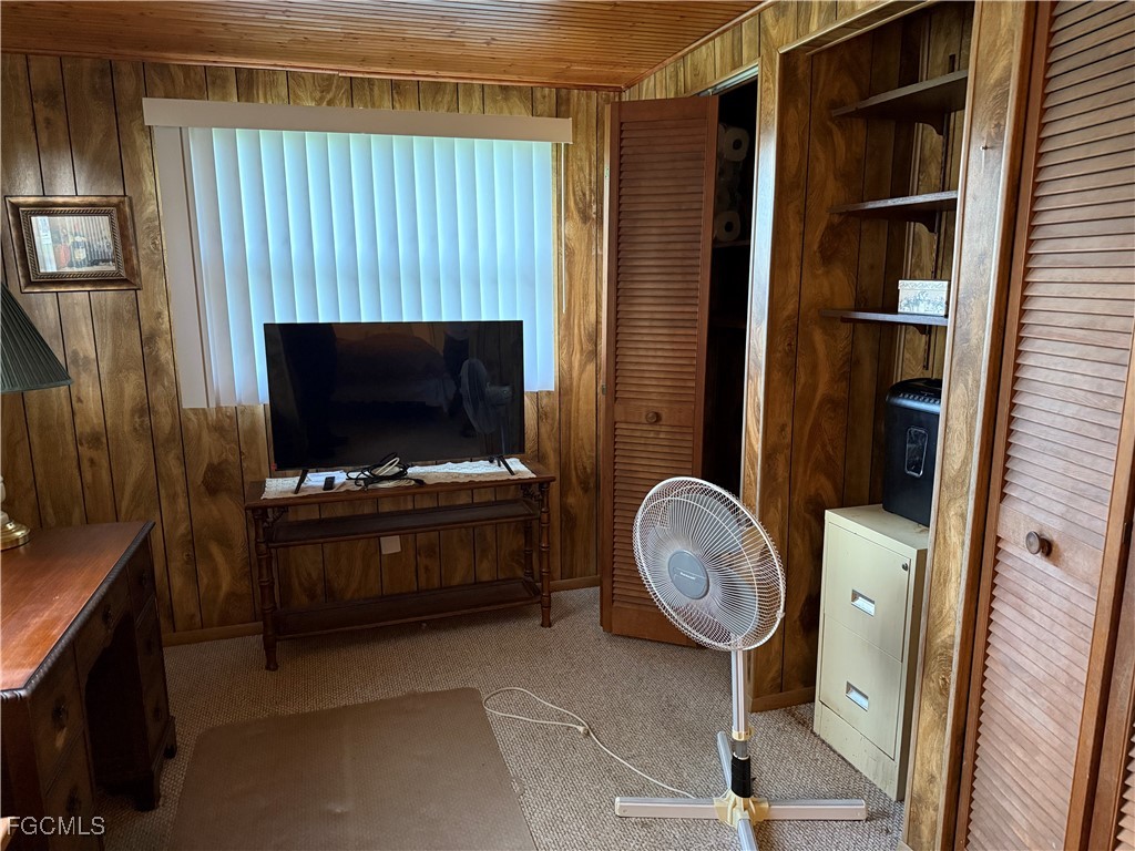 2211 Orchid Road Lehigh Acres, FL 33936 - Photo 9 of 11 a room with furniture and a fireplace