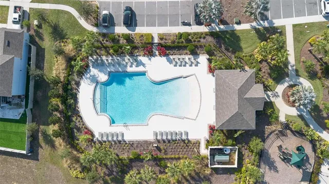 an aerial view of a house with outdoor space