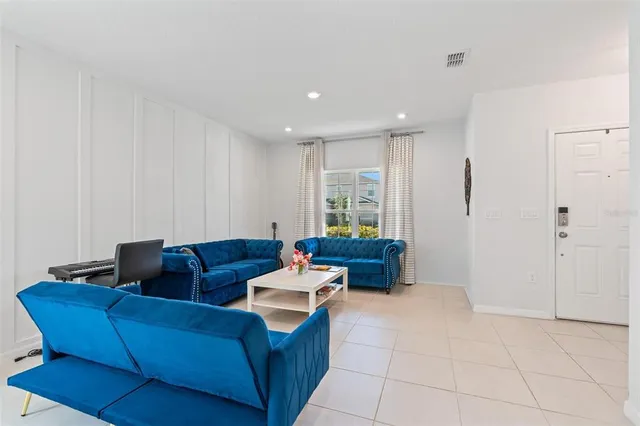 a living room with furniture and a window