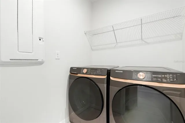 a utility room with dryer and washer