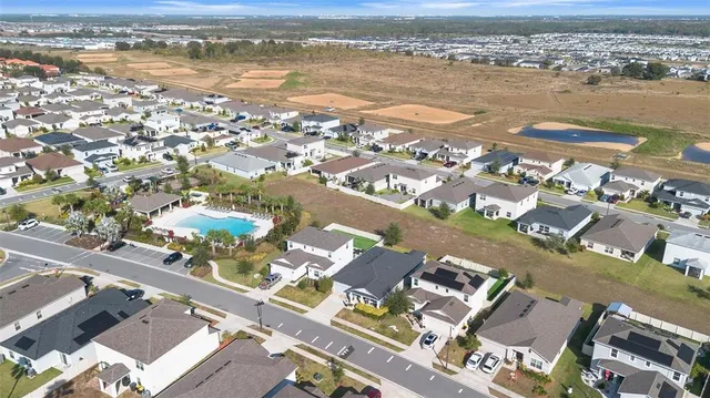 an aerial view of residential building with an ocean view