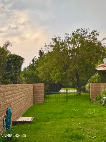 a backyard of a house with lots of green space