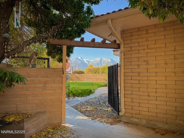 a living room with fireplace furniture and a rug