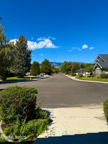 a view of a swimming pool with a yard