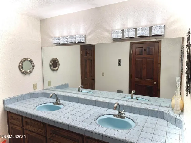 a bedroom with bed and window