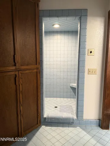 a bedroom with furniture and a flat screen tv