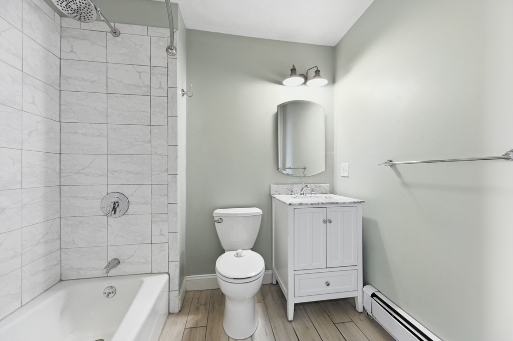 54 Beacon Street, Unit 2 Chelsea, MA 02150 - Photo 14 of 26 a bathroom with a toilet sink and shower