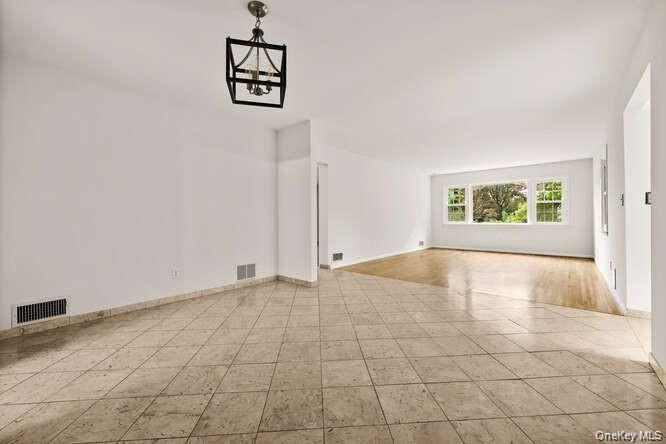 93 Seton Drive New Rochelle, NY 10804 - Photo 11 of 31 an empty room with windows and ceiling fan