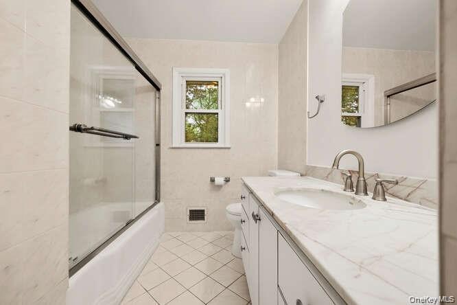 93 Seton Drive New Rochelle, NY 10804 - Photo 14 of 31 a bathroom with a sink and a mirror