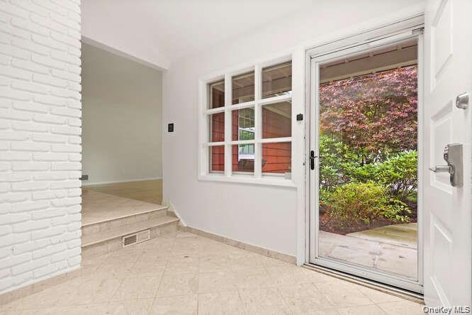 93 Seton Drive New Rochelle, NY 10804 - Photo 2 of 31 a view of an empty room with a window