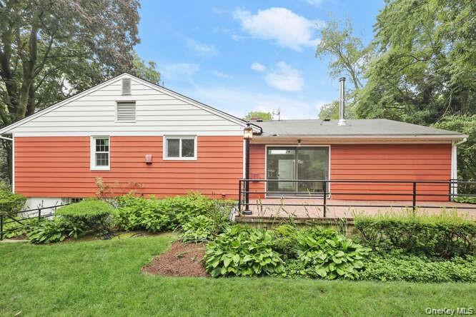 93 Seton Drive New Rochelle, NY 10804 - Photo 28 of 31 a backyard of a house with plants and large tree