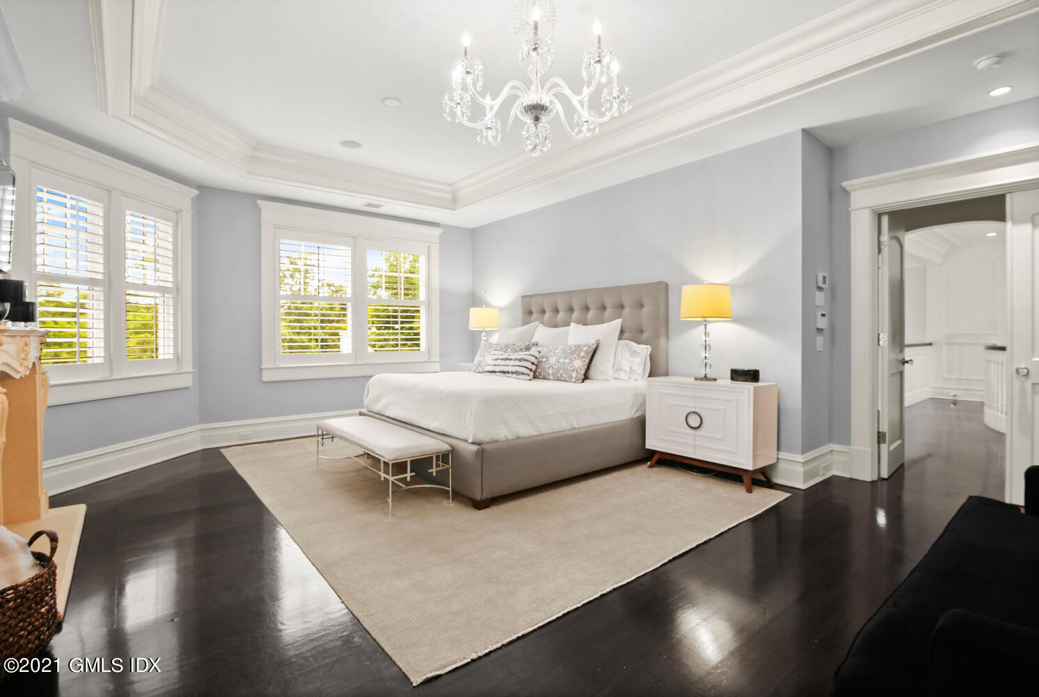 16 Dingletown Road Greenwich, CT 06830 - Photo 14 of 35 a bedroom with a large bed and a chandelier