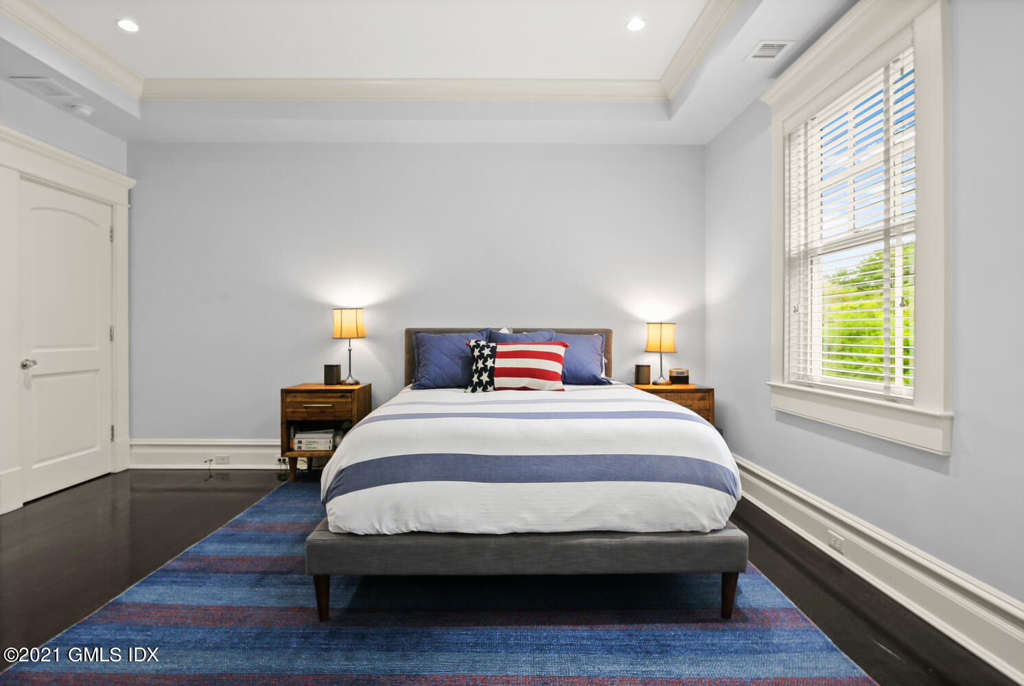 16 Dingletown Road Greenwich, CT 06830 - Photo 19 of 35 a bedroom with a bed and wooden floor