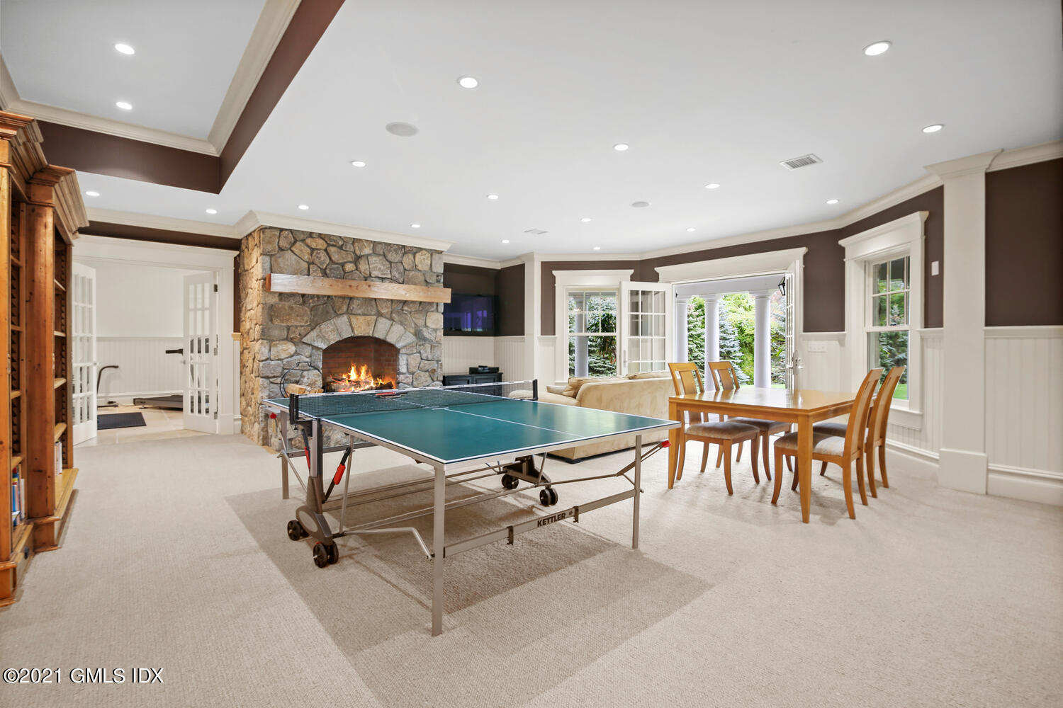 16 Dingletown Road Greenwich, CT 06830 - Photo 23 of 35 a living room with furniture a rug and a fireplace