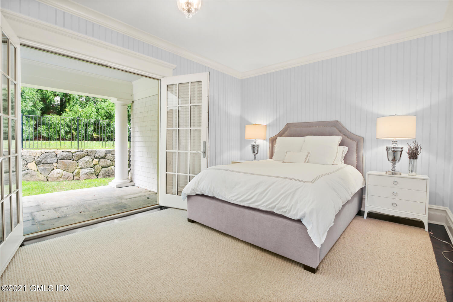 16 Dingletown Road Greenwich, CT 06830 - Photo 28 of 35 a spacious bedroom with a bed and a large window