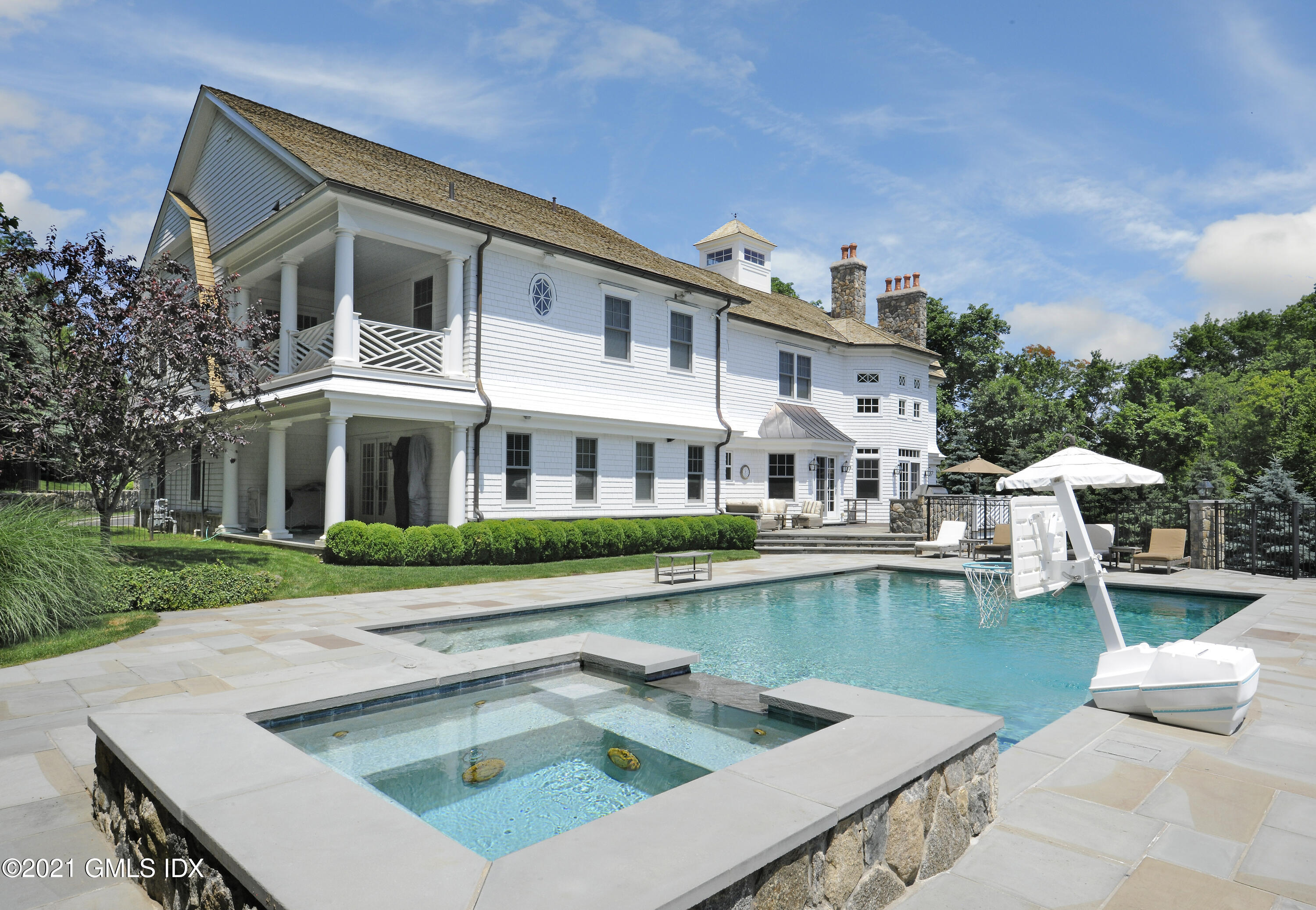 16 Dingletown Road Greenwich, CT 06830 - Photo 30 of 35 a front view of a house with swimming pool having outdoor seating