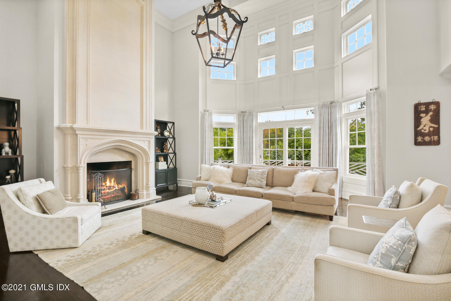 16 Dingletown Road Greenwich, CT 06830 - Photo 3 of 35 a living room with furniture a fireplace and a large window