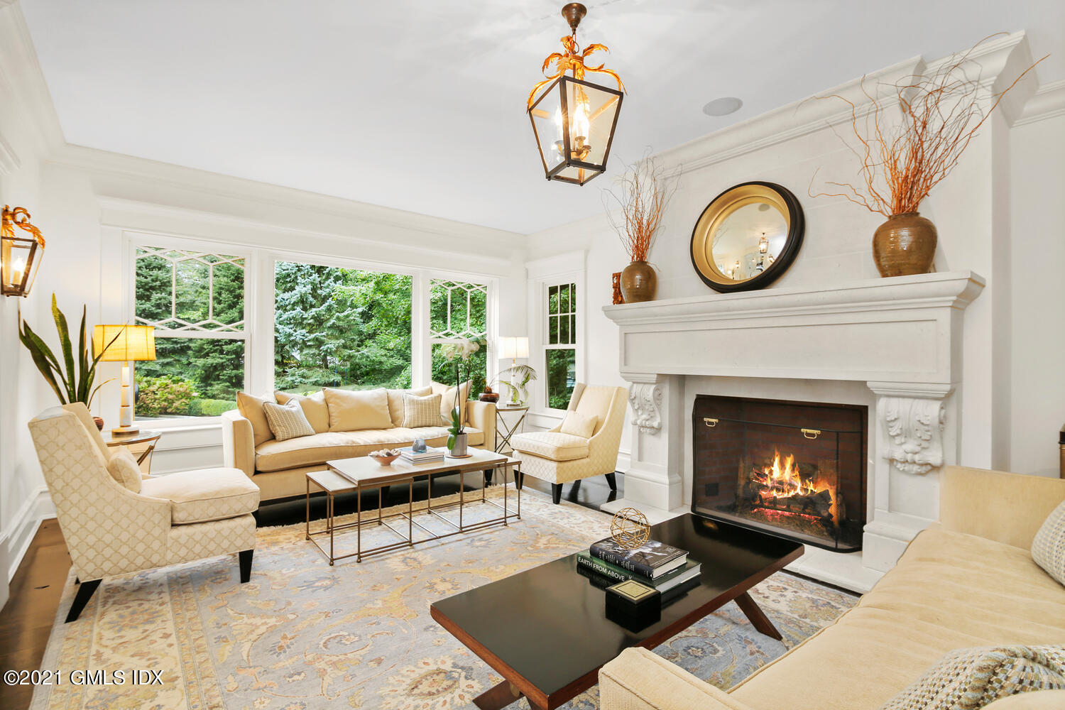 16 Dingletown Road Greenwich, CT 06830 - Photo 5 of 35 a living room with furniture a fireplace and a large window