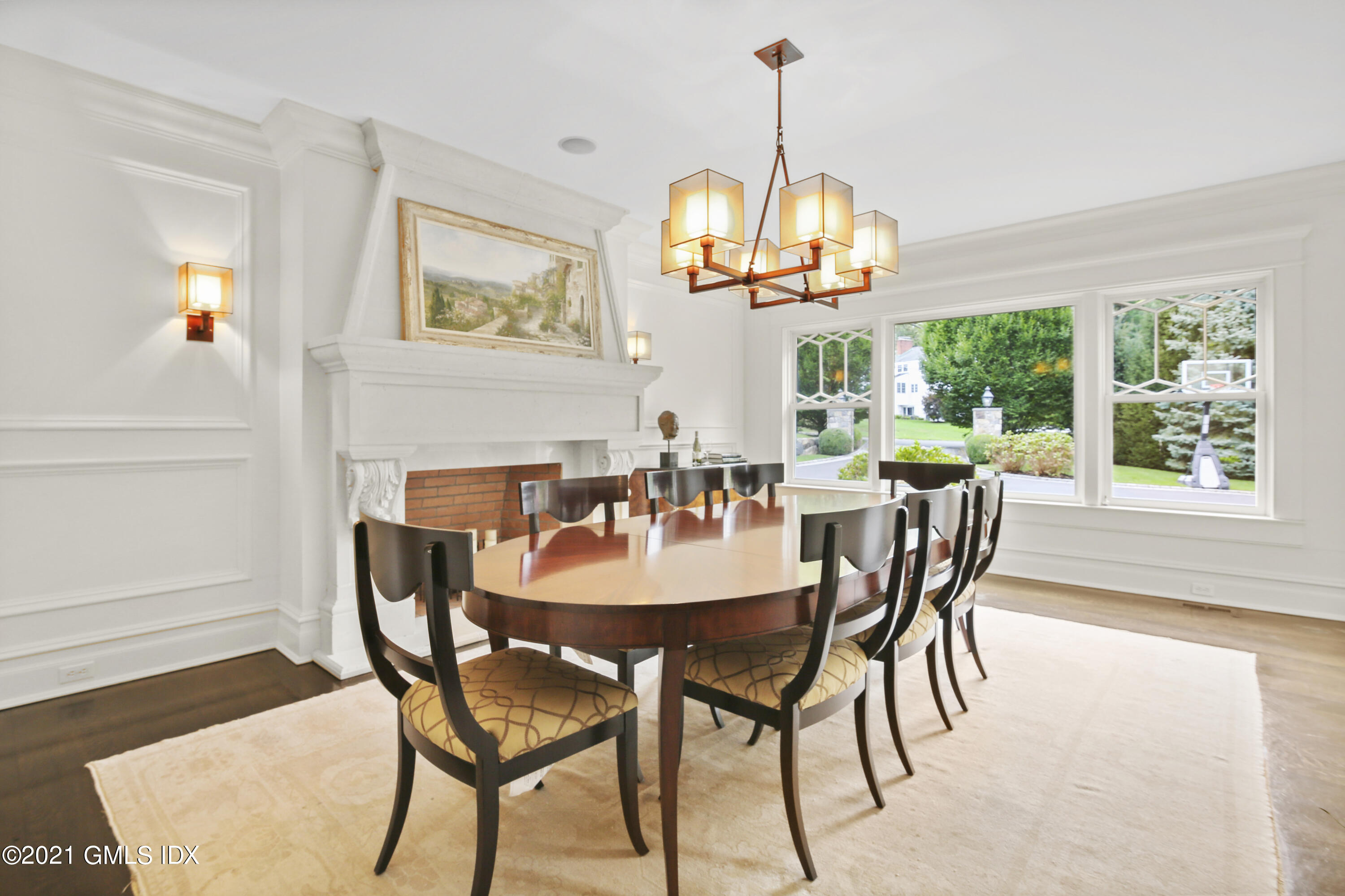 16 Dingletown Road Greenwich, CT 06830 - Photo 6 of 35 a view of a dining room with furniture a chandelier and wooden floor