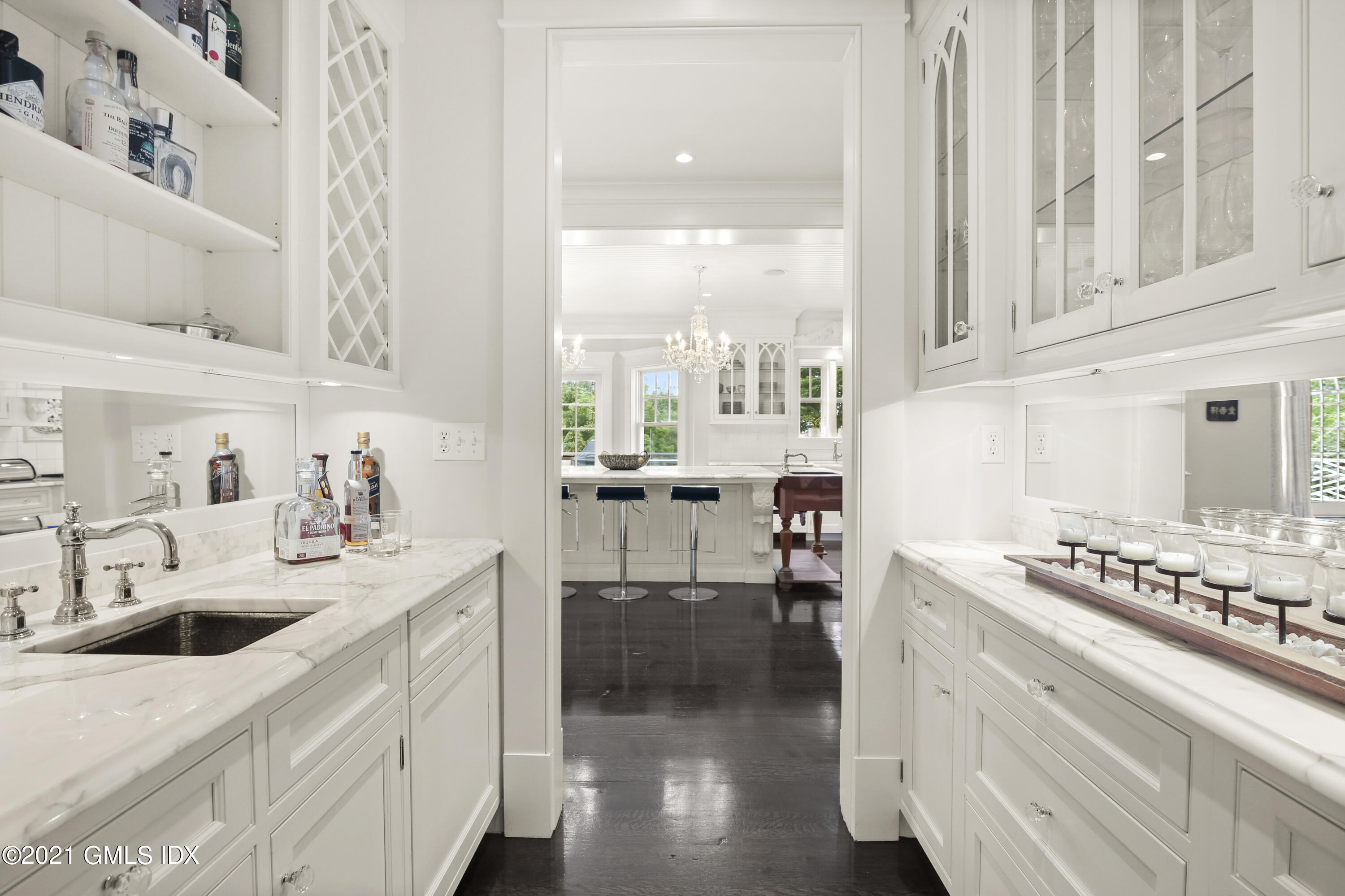 16 Dingletown Road Greenwich, CT 06830 - Photo 7 of 35 a kitchen with a sink stove and cabinets
