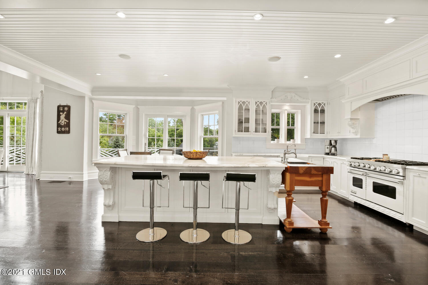 16 Dingletown Road Greenwich, CT 06830 - Photo 8 of 35 a kitchen with stainless steel appliances granite countertop a stove and white cabinets