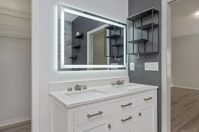 a bathroom with a sink and a mirror