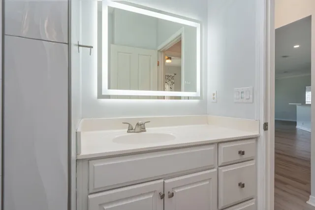 a bathroom with a sink and a mirror