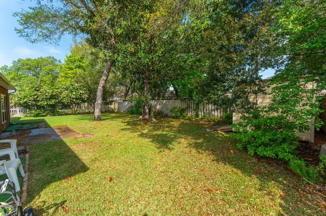 a swimming pool with wooden fence