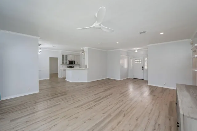 a view of a kitchen with a sink and a refrigerator