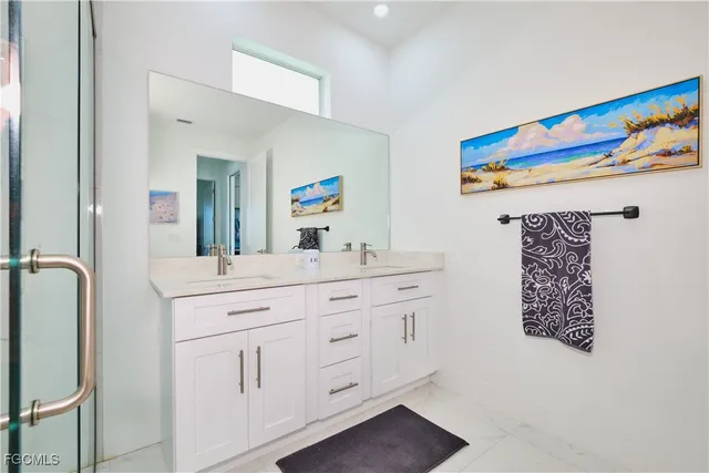 a bathroom with a sink a vanity and a mirror