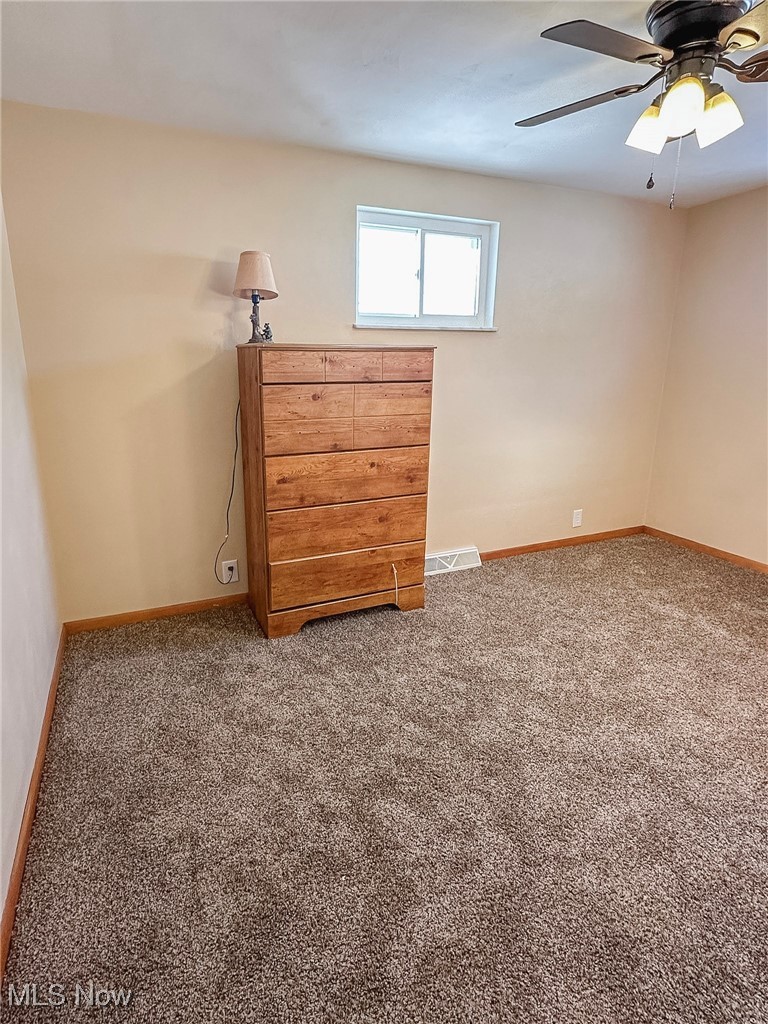 461 Tr 376 Road Toronto, OH 43964 - Photo 13 of 35 Carpeted spare room featuring ceiling fan