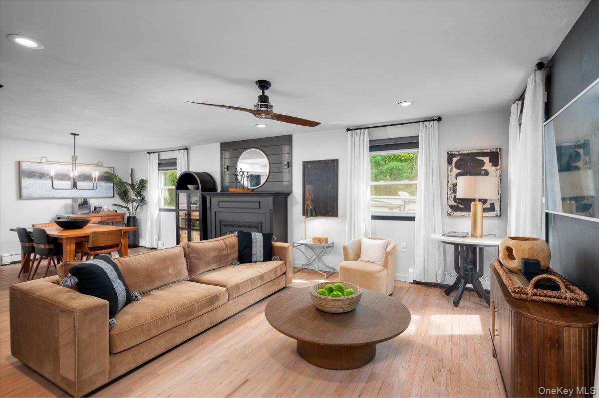 13 Jacks Pond Road Newburgh, NY 12550 - Photo 5 of 44 Open-concept living area with light wood-finish flooring, a contemporary ceiling fan, and recessed lighting.