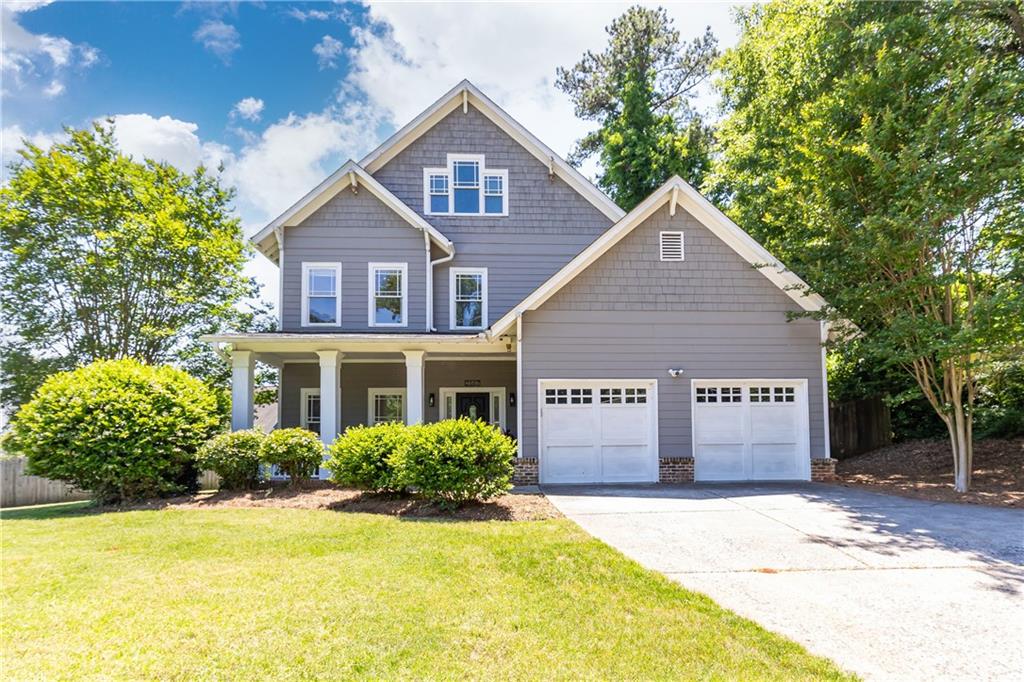 2167 Tilson Road Decatur, GA 30032 - Photo 1 of 1 a front view of a house with a yard and garage
