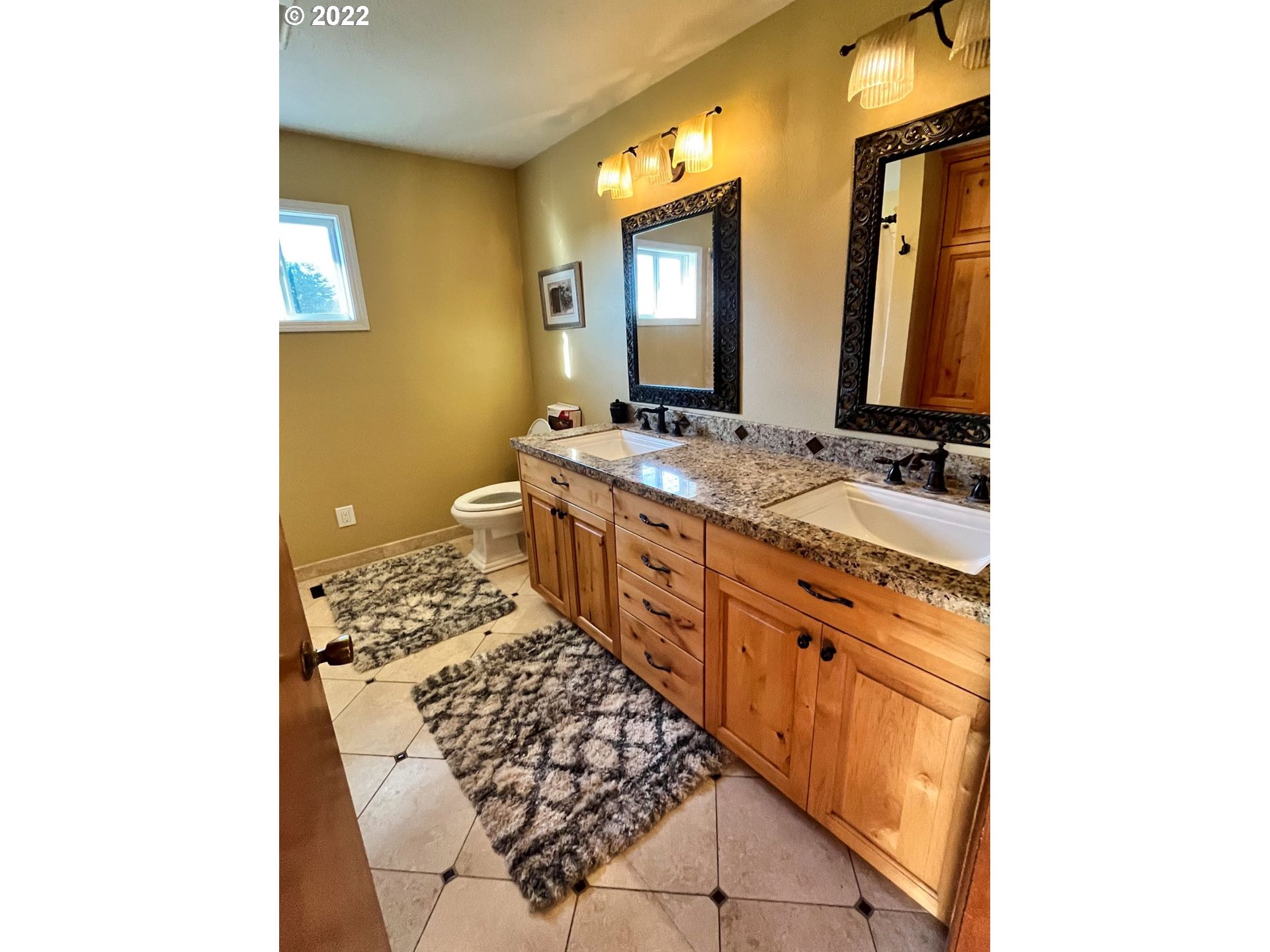 1675 Makinster Road Tillamook, OR 97141 - Photo 13 of 29 a bathroom with double vanity and a mirror