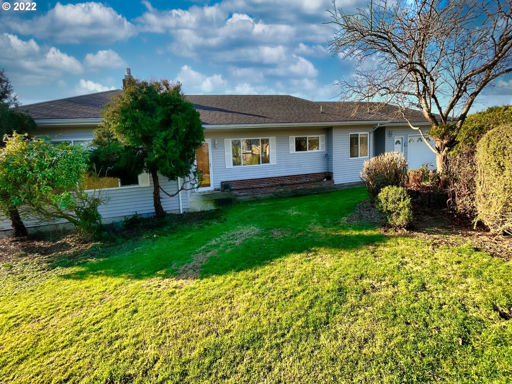 1675 Makinster Road Tillamook, OR 97141 - Photo 2 of 29 a front view of a house with garden