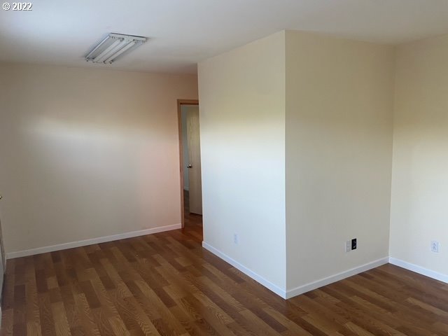 1675 Makinster Road Tillamook, OR 97141 - Photo 27 of 29 a view of an empty room with wooden floor and closet